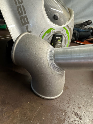 cast alloy bend with blow off valve fitting