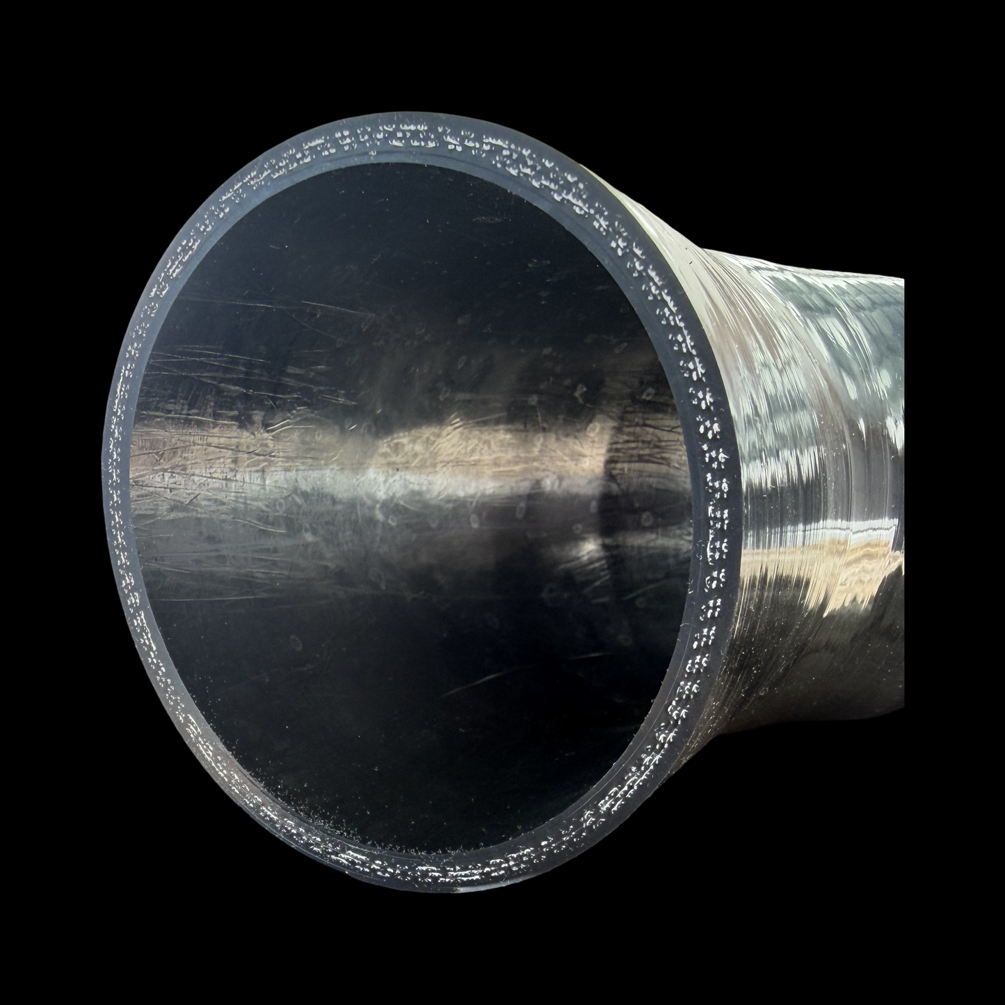Cut edge of a 45 degree silicone joiner showing the 4-ply reinforcement layers