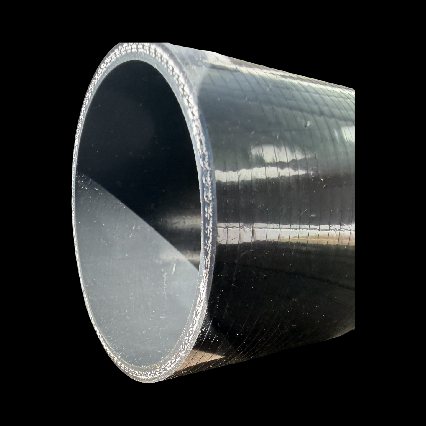 Cut edge of a straight silicone joiner showing the 4-ply reinforcement layers